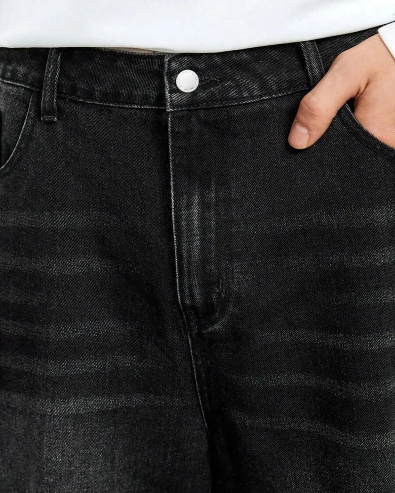 Waist detail of Eizaro baggy black denim jeans showing quality construction